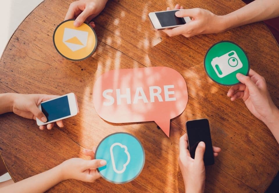 a table with mobile phones and social icons