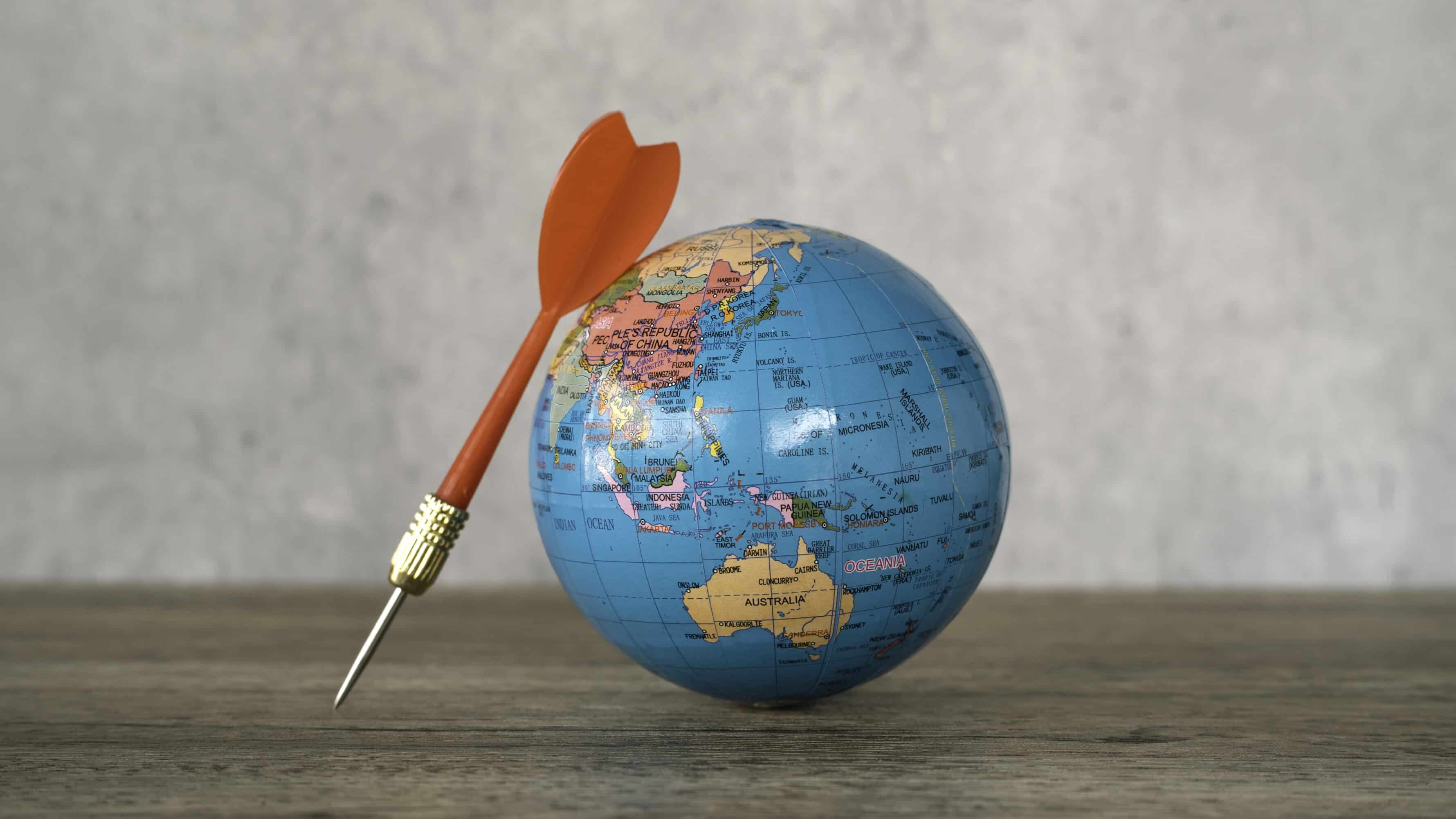 Red dart and a globe