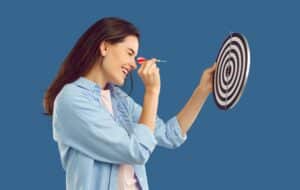 Woman targeting dart