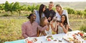 group of people drinking wine and talking
