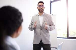 Man speaking in front of business meeting